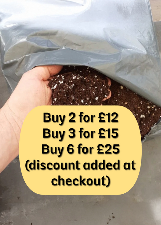 Hand holding a bag of soil with a promotional text overlay on a gray surface